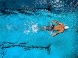 aerial view of a swimmer as he swims in a pool of fresh water